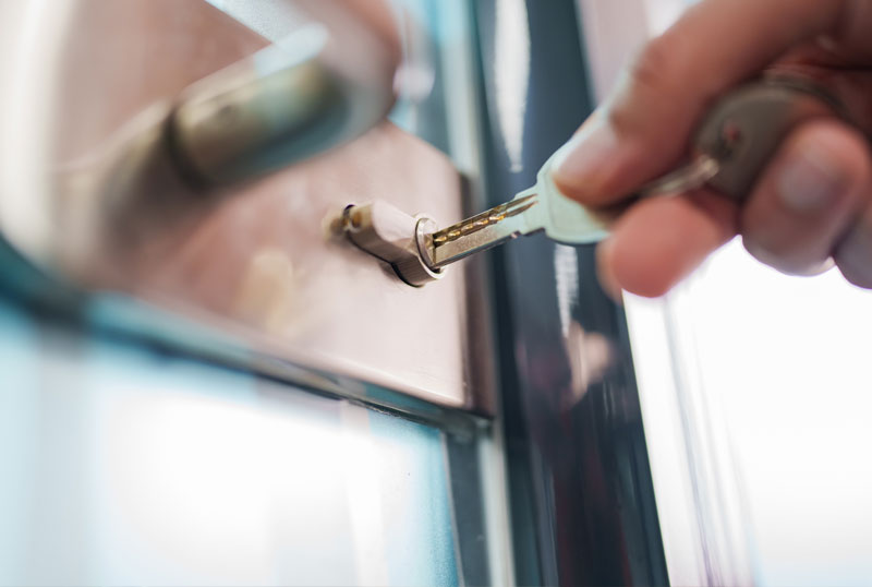 some one using the master key to open a office door