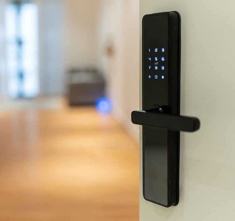 open door in a residence that has a black keyless lock on it with a keypad